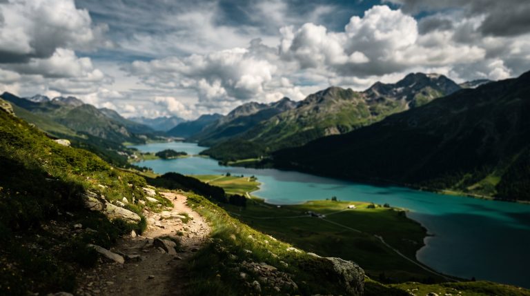 Panoramic view of the turquoise Engadin valley lakes near St. Moritz in July
