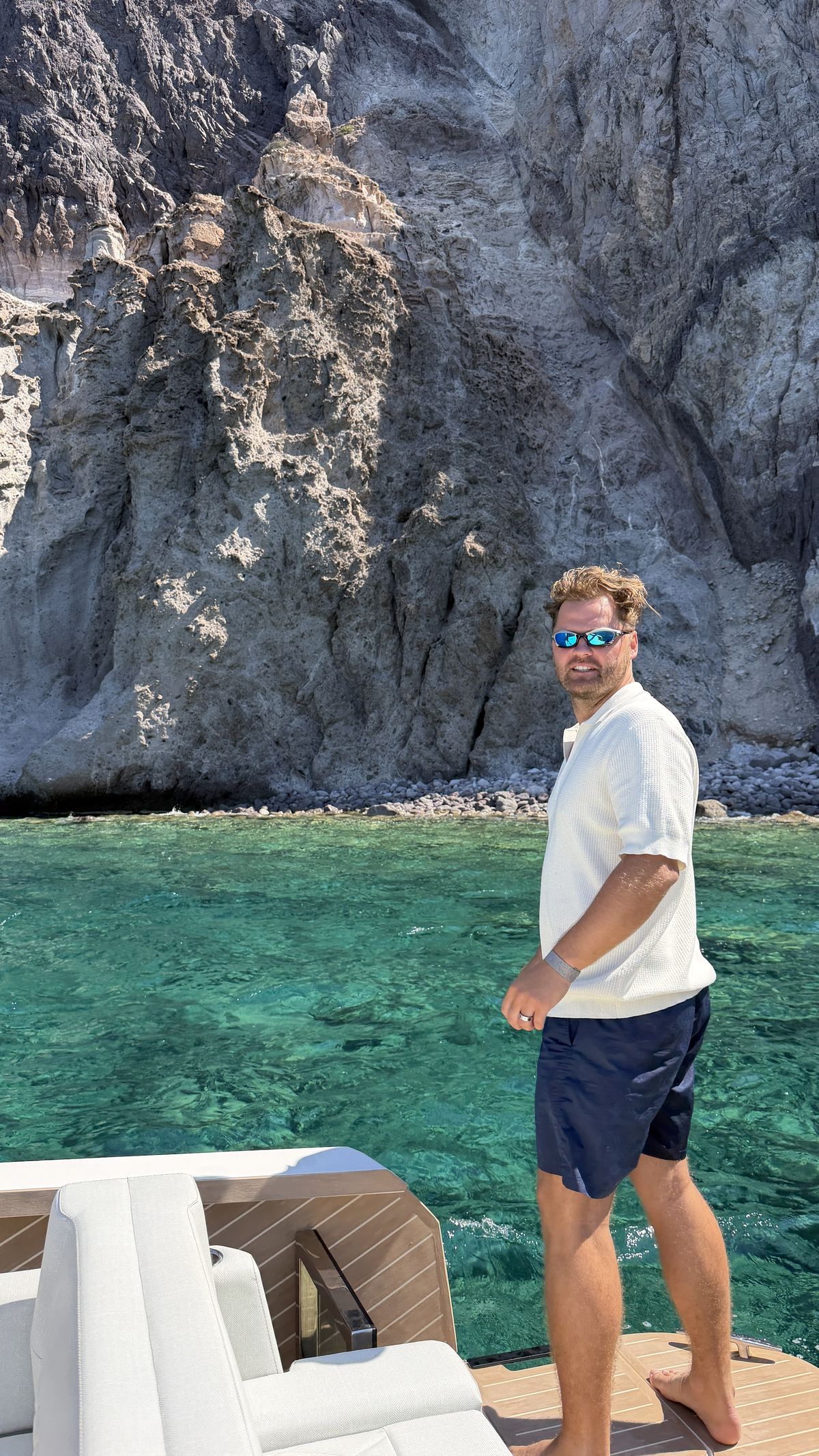 Max Zaharenkov on the bow beneath the cliffs near Despotiko